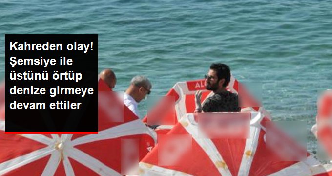 Antalya’da yaşamını yitiren adamı gören vatandaşlar denize girmeye devam etti!