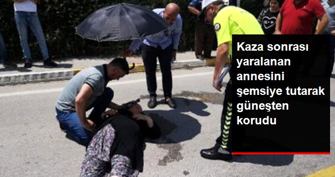 Ambulans gelene kadar kazada yaralanan annesinin üzerine şemsiye tuttu